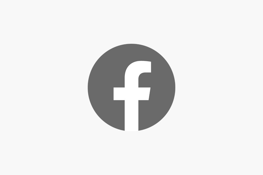 Un círculo gris con una "f" minúscula blanca en el centro, que representa el logotipo de Facebook.