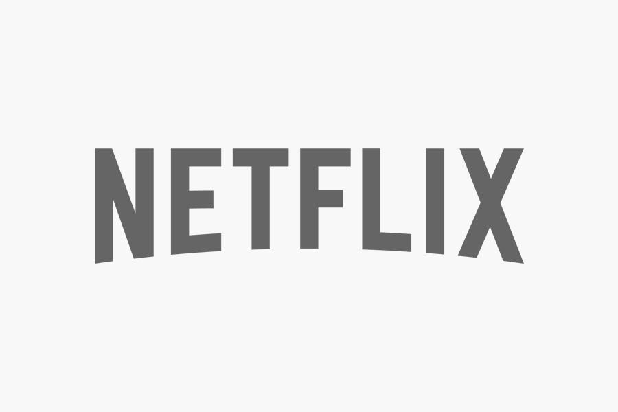 La palabra "NETFLIX" aparece en letras mayúsculas, grises y en negrita sobre un fondo blanco liso.